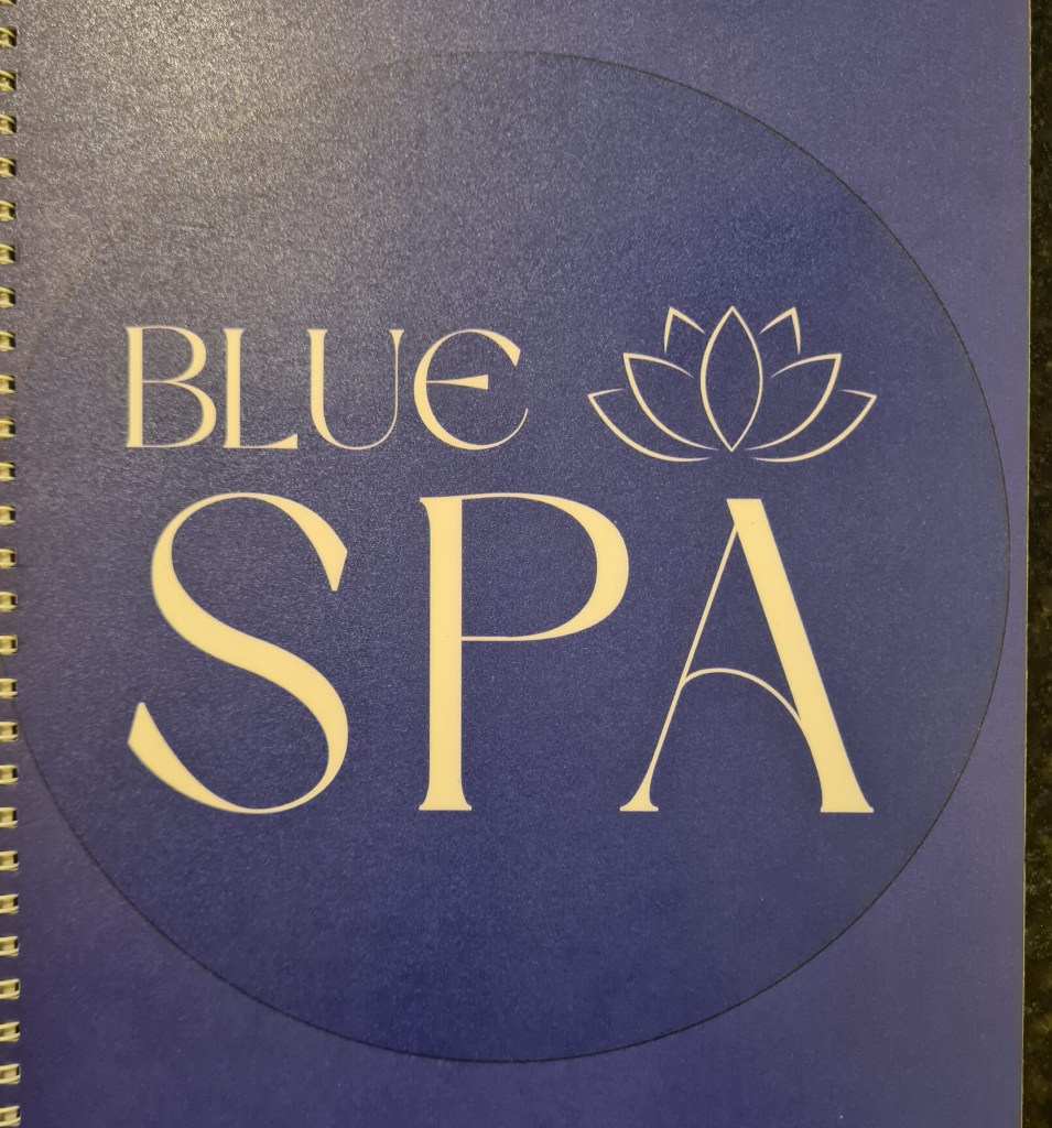 Logo design for 'Blue Spa' featuring elegant typography and a lotus flower on a blue background.