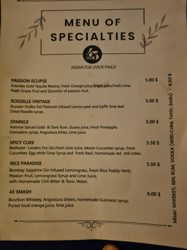 A menu displaying a selection of signature cocktails with names, ingredients, and prices, including items like Passion Eclipse, Rosselle Vintage, Sparkle, Spicy Cuke, Rice Paradise, and 43 Smash.